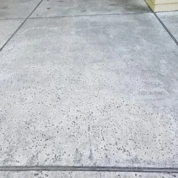 Clean concrete driveway pressure washed